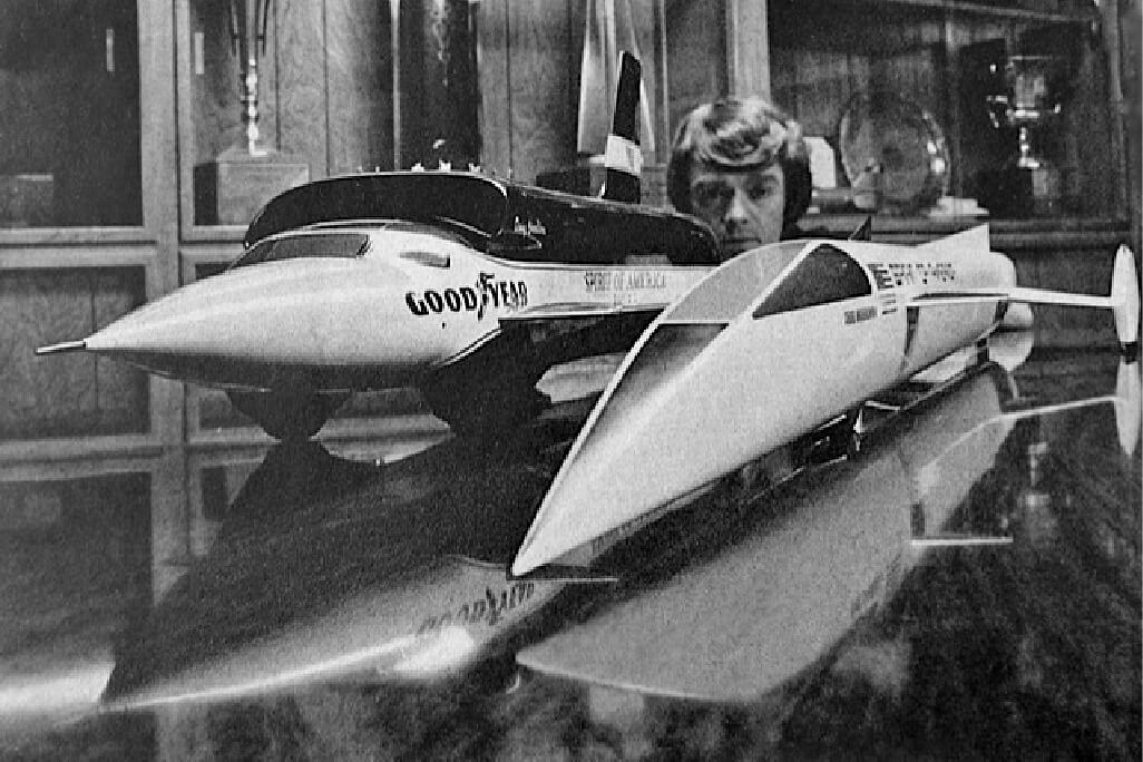 Craig Breedlove with models of Sonic I and a concept for a rocket car