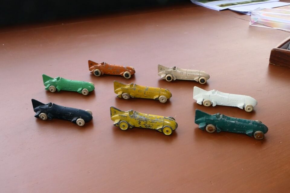 A selection of tootsietoy 1928 BBs. These were never described as BBs in their advertising. In fact those with numbers on their tails were included in a boxed set with a racing game where eight BBs were arbitrarily named as Cadillac.