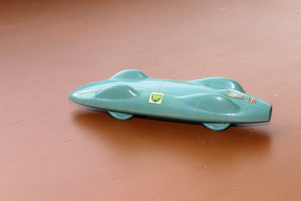 England Jetex. Plastic, powered by Jetex rocket cartridges the car runs straight along a fixed fishing line run between the two tether lugs on the left side. 163mm